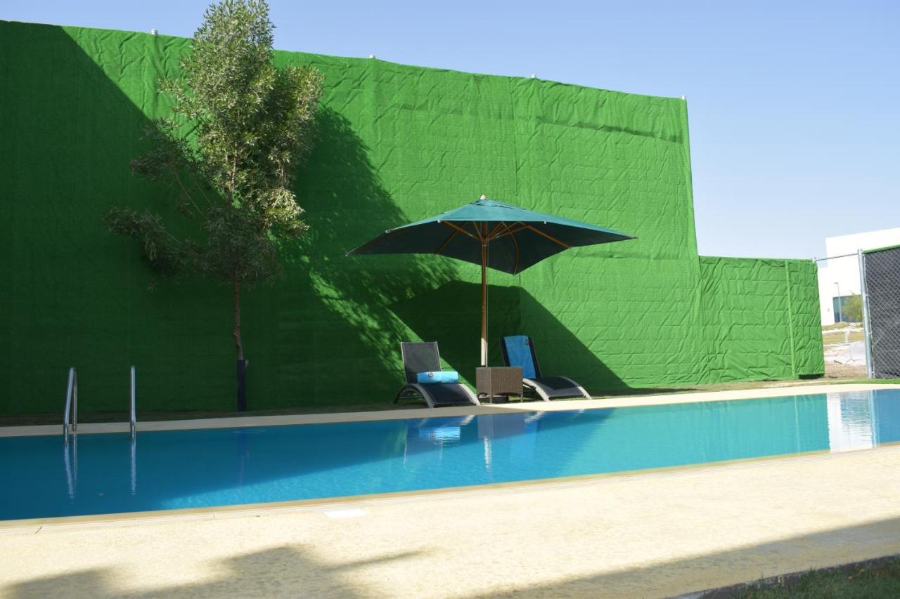 Retaj Salwa Resort & Spa Doha Eksteriør billede A swimming pool in Spain